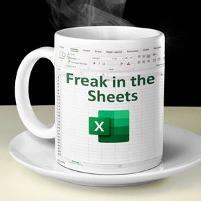 Freak in the Sheets Excel coffee mug featuring witty spreadsheet design, perfect for data lovers.