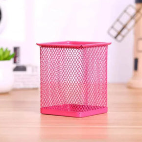 Red metal mesh pen holder for office desk organization.