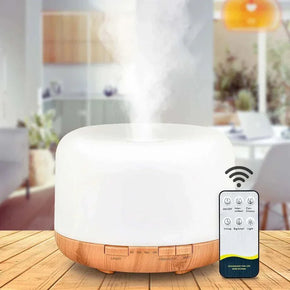 Air Humidifier Essential Oil Diffuser with Remote Control and Lights on Wooden Table